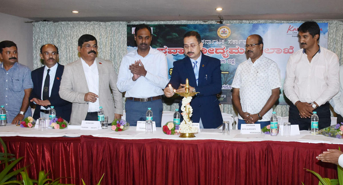 Karnataka State Tourism Development Corporation Managing Director Pushkar Kumar inaugurates, 'Connect', a preparatory meeting on tourism, in Madikeri on Friday.