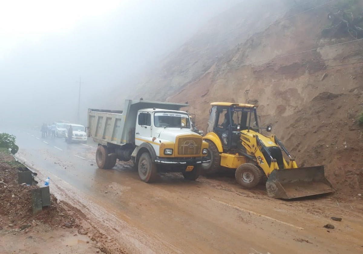 The debris near Karthoje, accumulated due to a landslide on Madikeri-Mangaluru National Highway, was cleared on Tuesday.