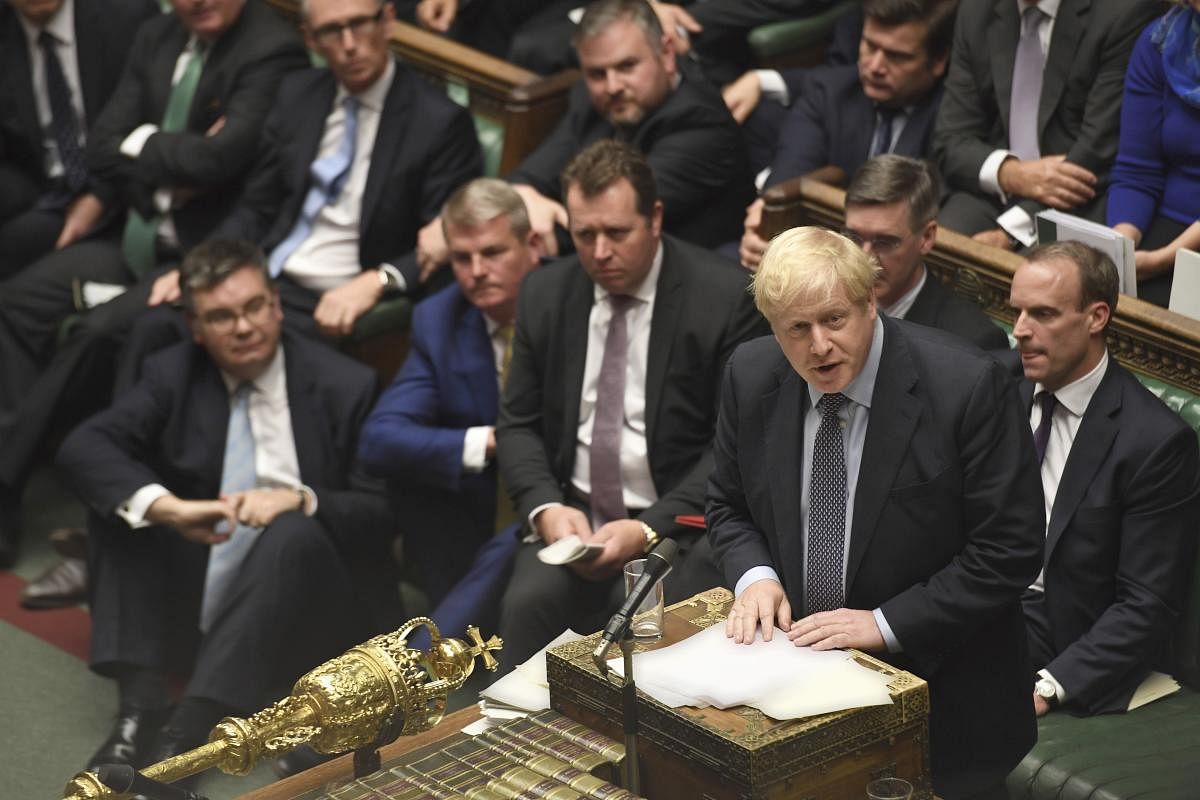 Boris Johnson speaks during the Brexit debate inside the House of Commons in London. At the rare weekend sitting of Parliament, Johnson implored legislators to ratify the Brexit deal he struck this week with the other 27 EU leaders. Lawmakers voted Saturd