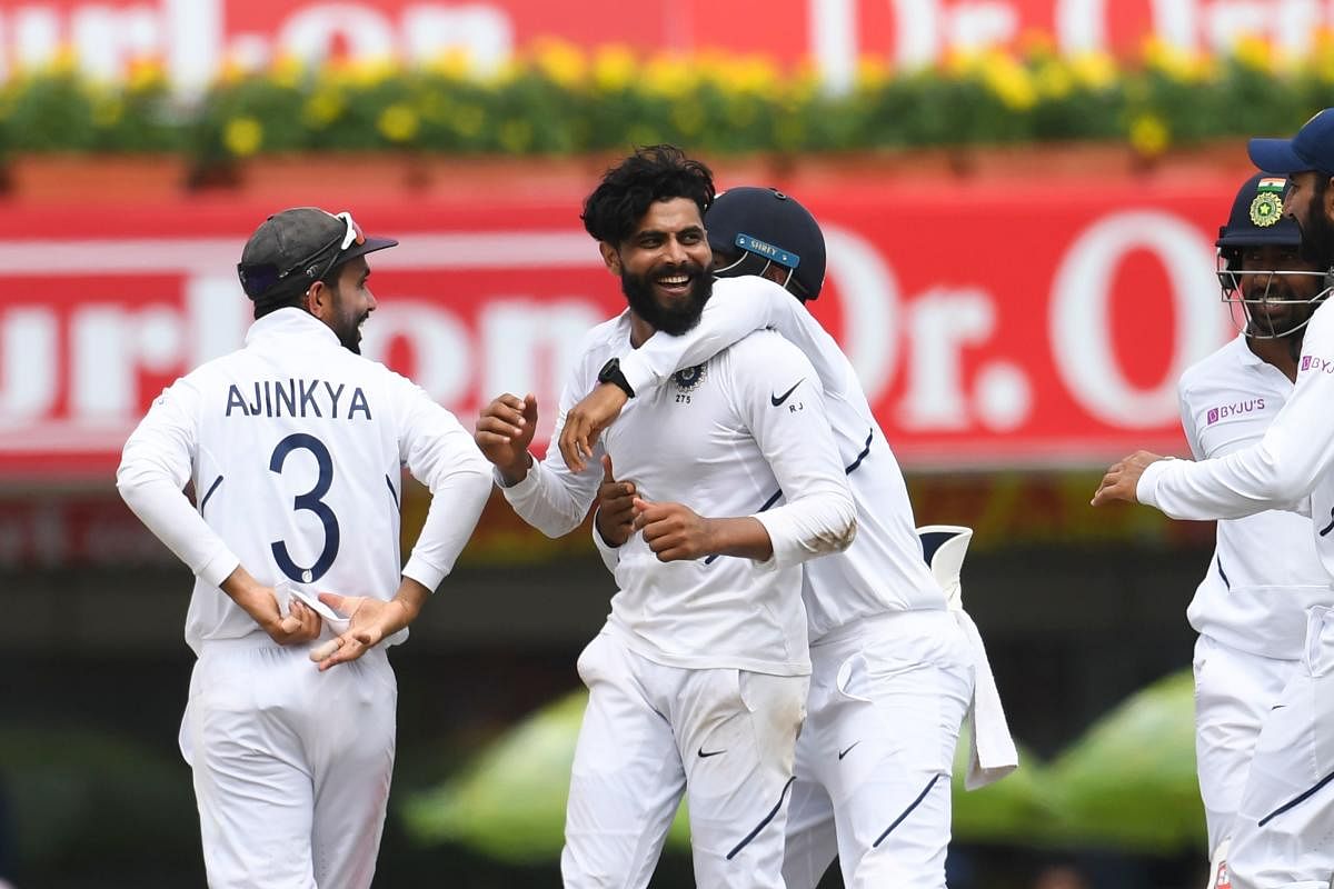 India's Ravindra Jadeja (C) celebrates with teammates after bowling out South Africa's Heinrich Klaasen (not pictured) during the third day of the third and final Test match between India and South Africa at the Jharkhand State Cricket Association (JSCA) stadium in Ranchi on October 21, 2019. (Photo by Money SHARMA / AFP)