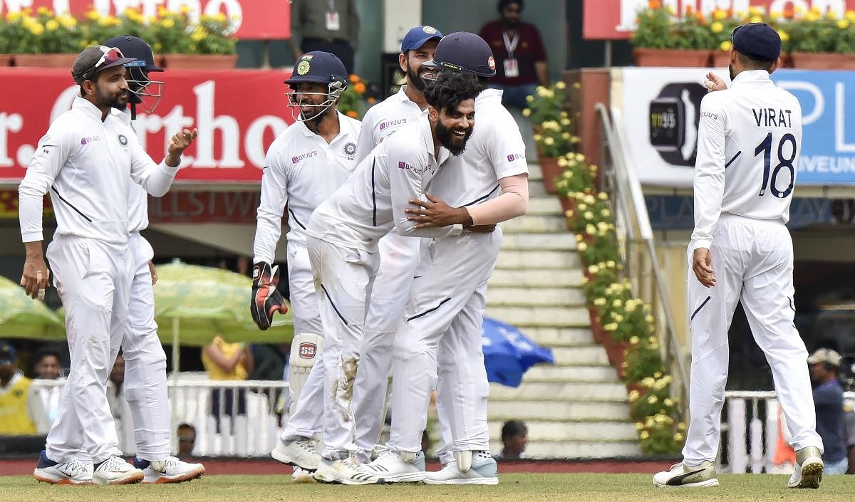 Indian player Ravindra Jadeja celebrates with teammates the dismissal of South Africa batsman Heinrich Klaasen during the third day of third and last cricket test match between India and South Africa, at JSCA Stadium in Ranchi, Monday, Oct. 21, 2019. (PTI Photo/Ashok Bhaumik)
