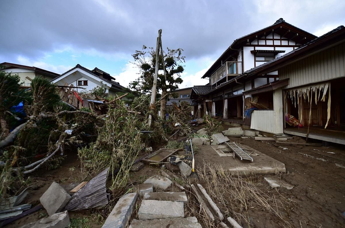 This picture taken on October 15, 2019 shows a flood-damaged house in Nagano, after Typhoon Hagibis hit Japan on October 12 unleashing high winds, torrential rain and triggered landslides and catastrophic flooding. (AFP)