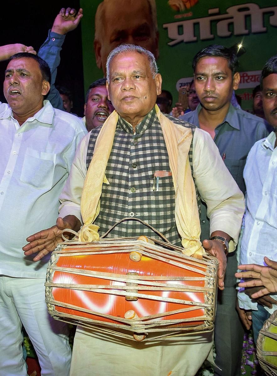 Former Bihar Chief Minister and Hindustani Awam Morcha (HAM) party president Jitan Ram Manjhi is beats a 'dhol' during Prantiya Musahar-Bhuiya Sammelan in Patna on Sunday. (PTI Photo)