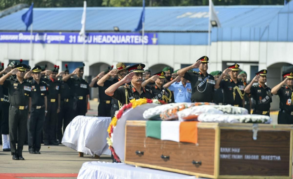 Vice-Chief of Army Staff Gen. M M Naravane along with Indian Army personnel pay tributes to martyrs Hawaldar Padam Bahadur Shrestha (Assam) &amp; Rifleman Gamil Kumar Shrestha at Palam Delhi Tech Area in New Delhi on Monday. (PTI Photo)