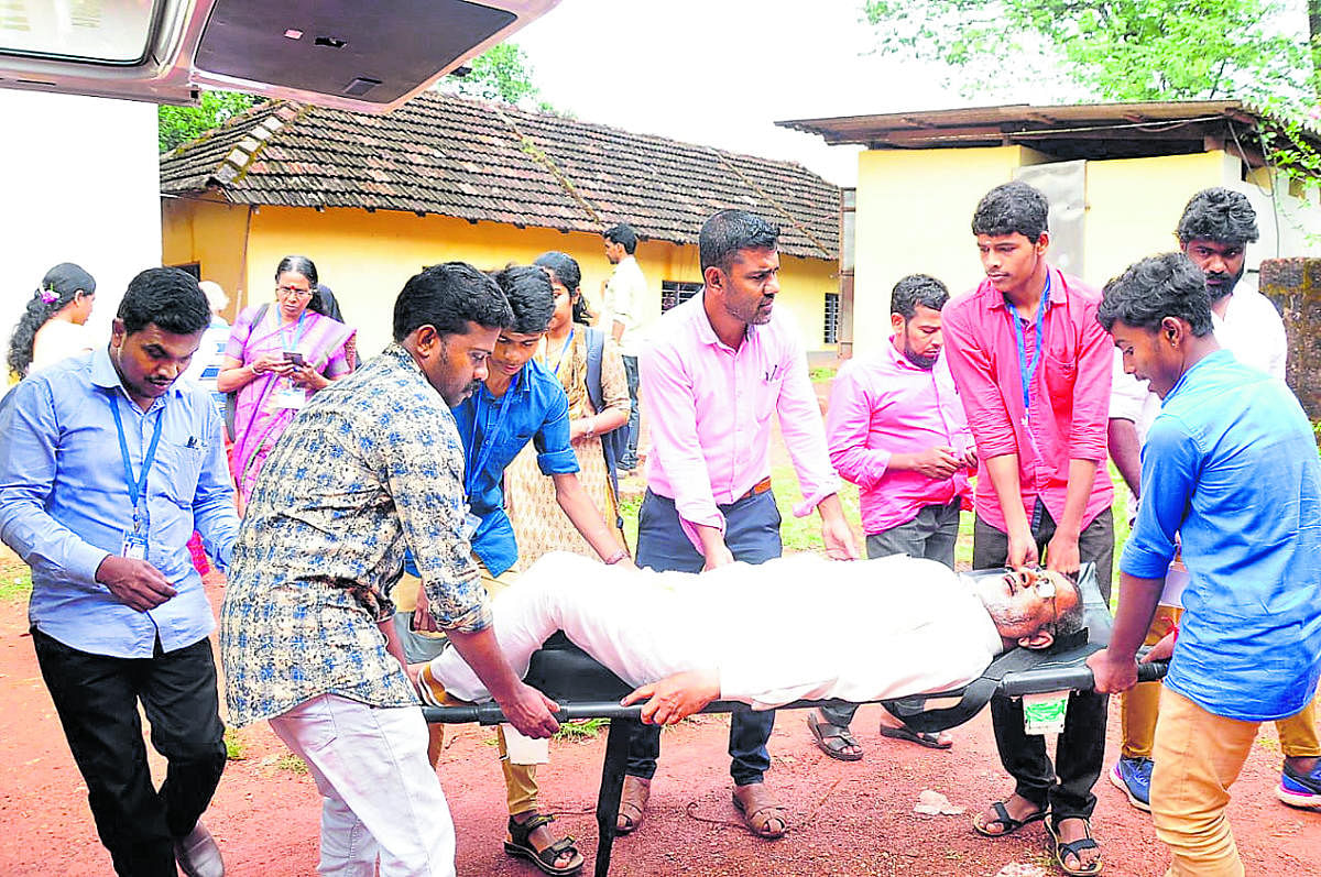 A patient being brought in a stretcher to the polling station at Paivalike to exercise franchise.