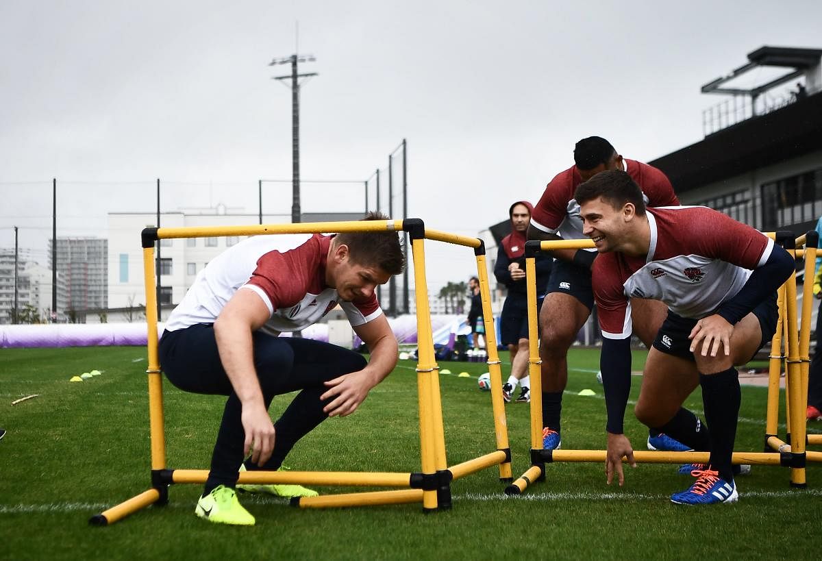England's centre Owen Farrell (L) and England's scrum-half Ben Youngs (R) take part in a training session at the Arcs Urayasu Park in Urayasu on October 22,2019 during the Japan 2019 Rugby World Cup. (Photo by Anne-Christine POUJOULAT / AFP)