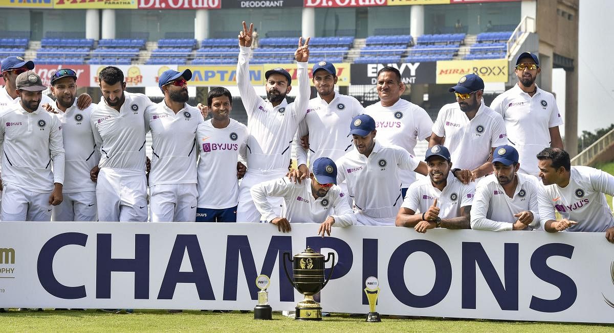 Indian captain Virat Kohli and team players pose with the trophy after winning the Test series against South Africa (PTI Photo)