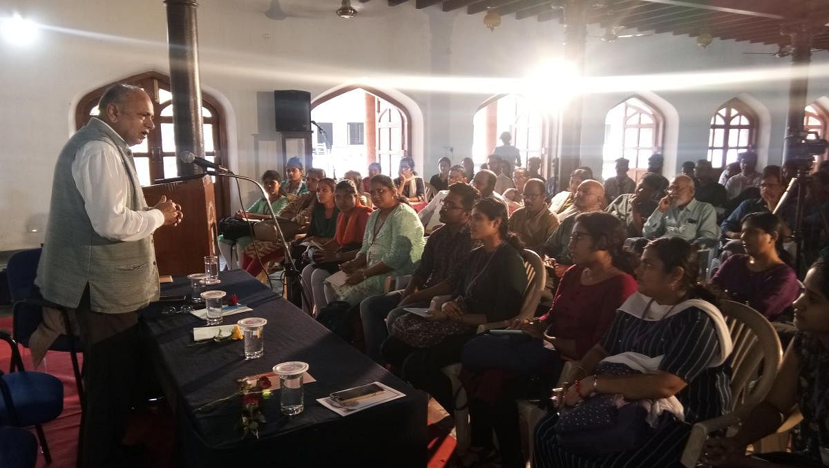 Scholar Prof G N Devy speaks at a discussion on Mahatma Gandhi at University College, Mangaluru, on Monday.