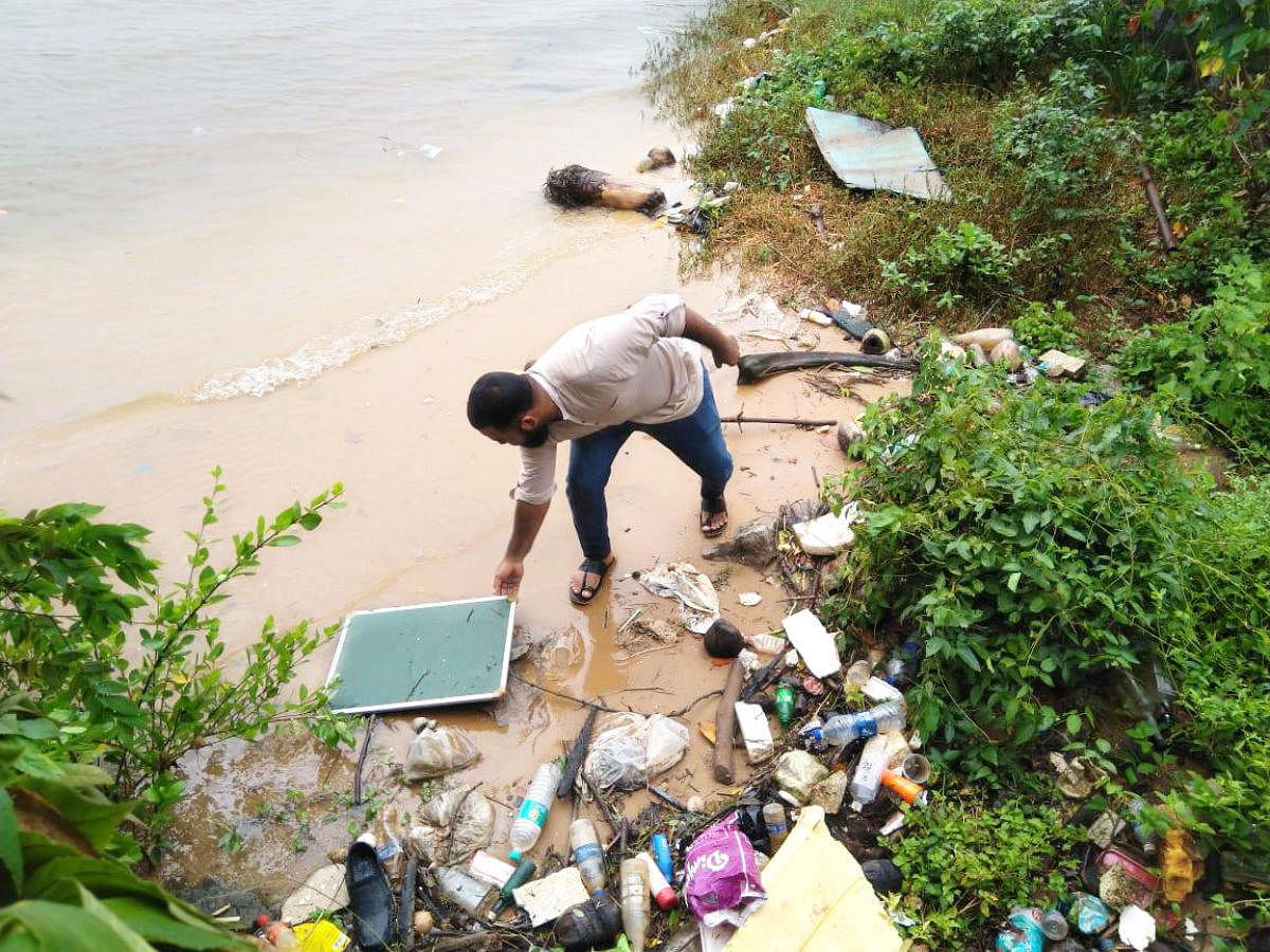 Waste dumped beside a river in Mangaluru.