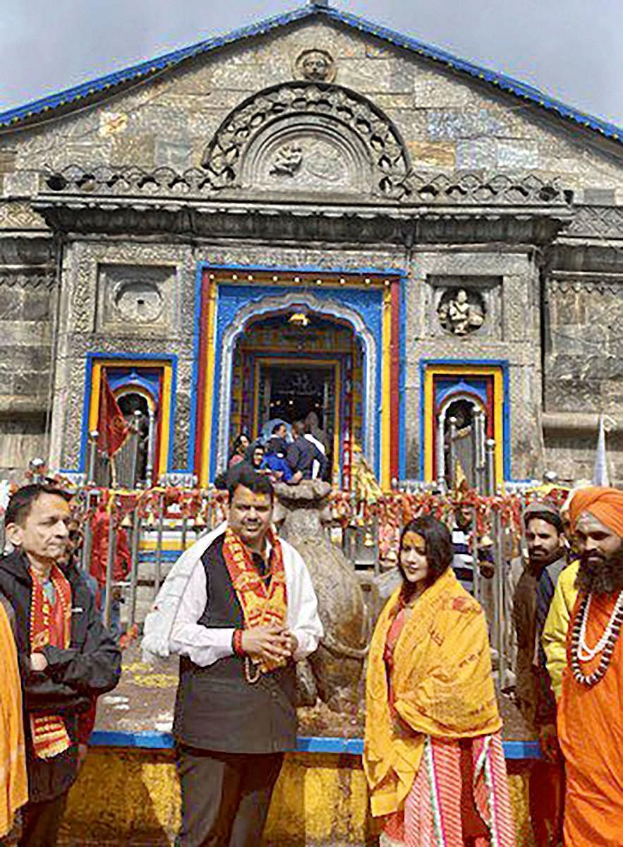 Maharashtra Chief Minister Devendra Fadnavis and his wife Amruta Fadnavis during their visit to Kedarnath Temple in Uttarakhand. (Twitter/PTI Photo)
