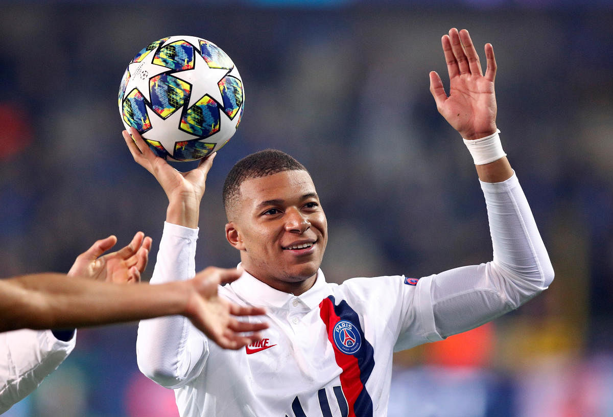 Paris St Germain's Kylian Mbappe celebrates after the match with the match ball. REUTERS/Francois Lenoir