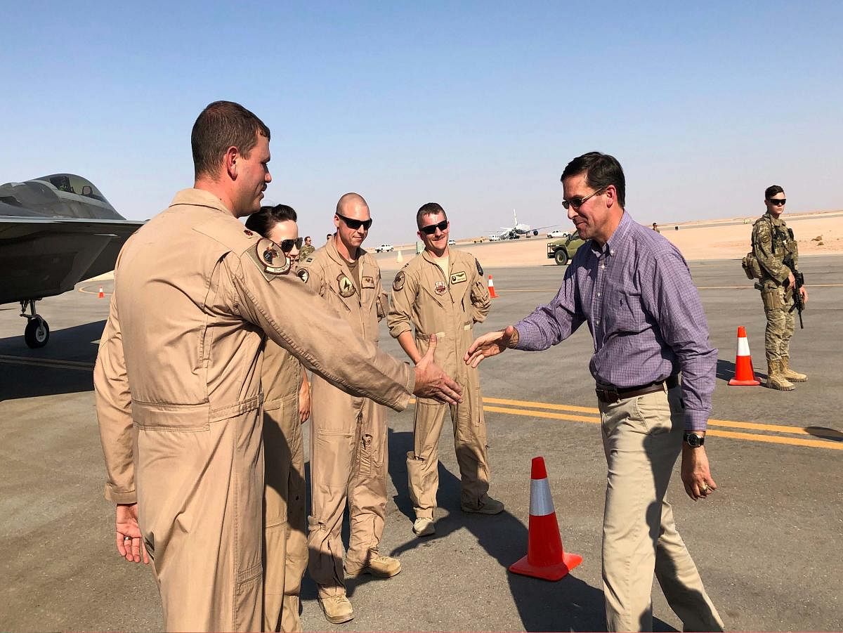 Defense Secretary Mark Esper talks with U.S. troops in front of an F-22 fighter jet deployed to Prince Sultan Air Base in Saudi Arabia, Tuesday, Oct. 22, 2019. AP/PTI Photo