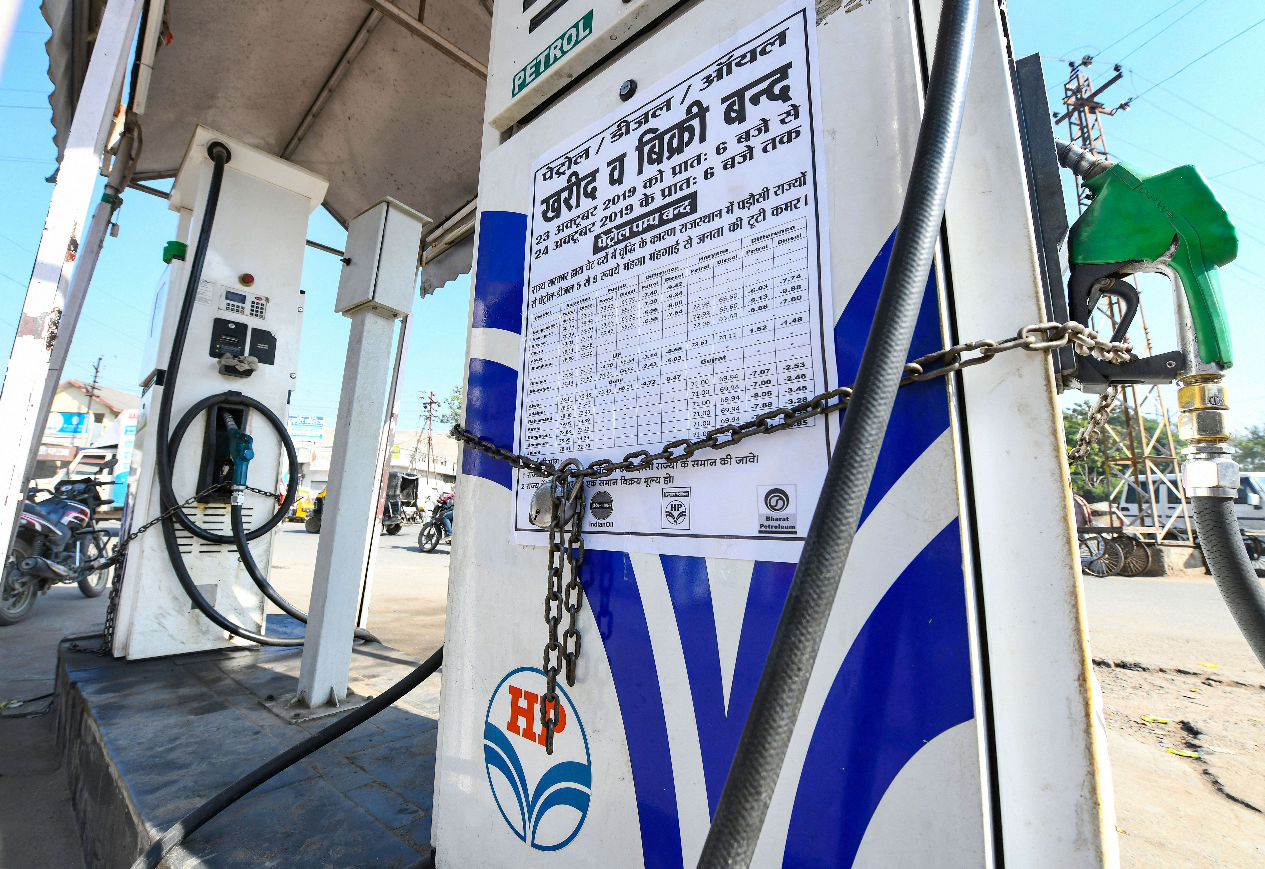 A notice is stuck on a closed petrol pump during a strike called by Rajasthan Pump Dealers Association against VAT rate, in Beawar. (PTI Photo)
