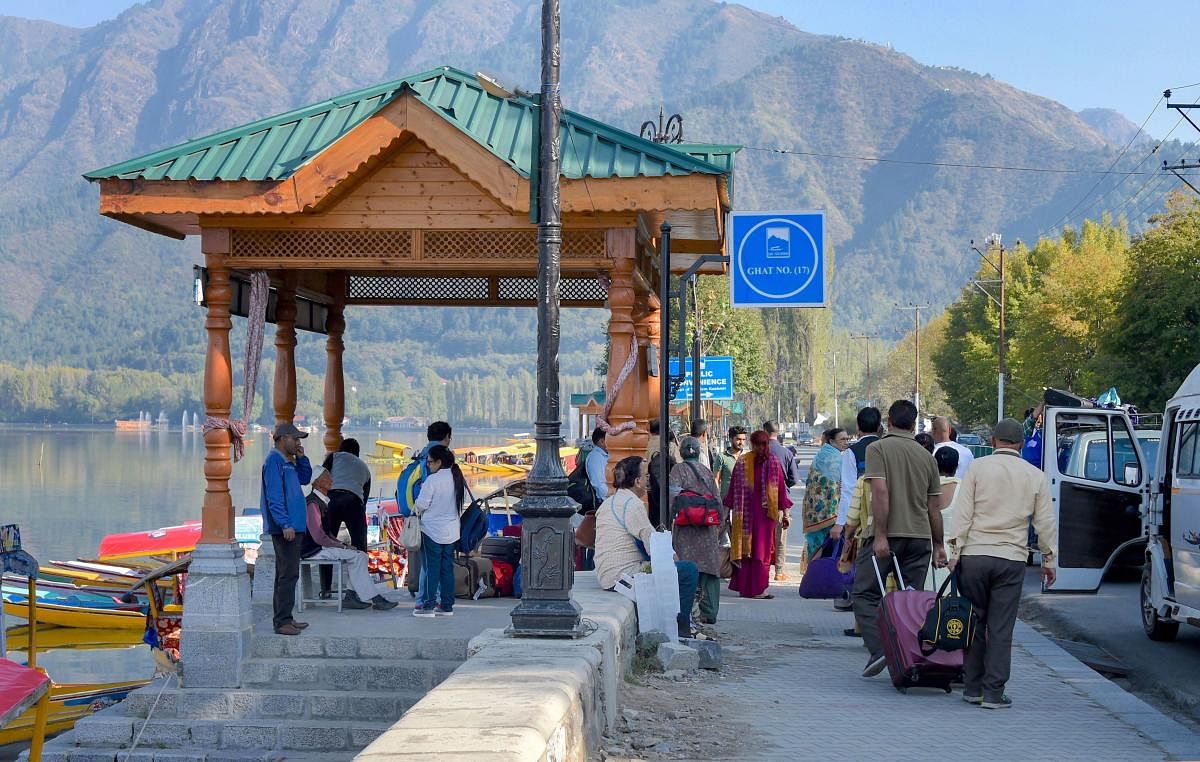File  PTI photo of tourists seen near the famous Dal Lake in Srinagar