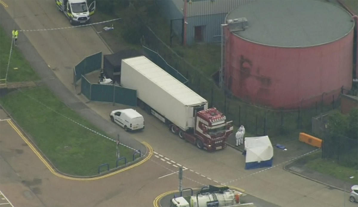 An aerial view as police forensic officers attend the scene after a truck was found to contain a large number of dead bodies, in Thurock, South England, early Wednesday Oct. 23, 2019. Police in southeastern England said that 39 people were found dead Wednesday inside a truck container believed to have come from Bulgaria. AP/PTI