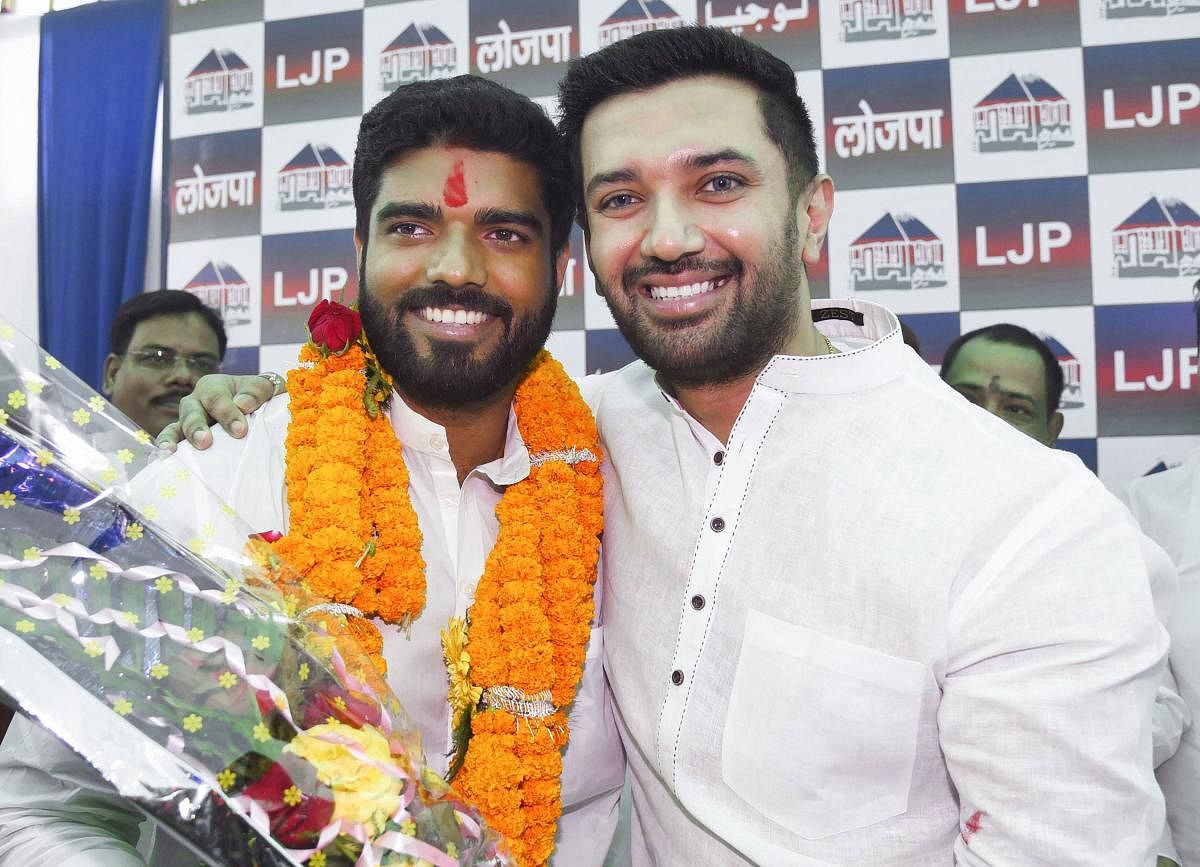  Lok Janshakti Party (LJP) parliamentary board chairman Chirag Paswan poses with the party's newly elected MP from Samastipur, Prince Raj, during a press conference in Patna, Friday, Oct. 25, 2019. (PTI Photo) 