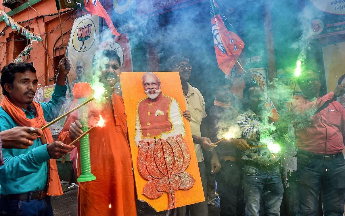 BJP Workers celebrates their victory in Maharashtra Assembly elections, in Kolkata, Thursday, Oct. 24, 2019. (PTI Photo)