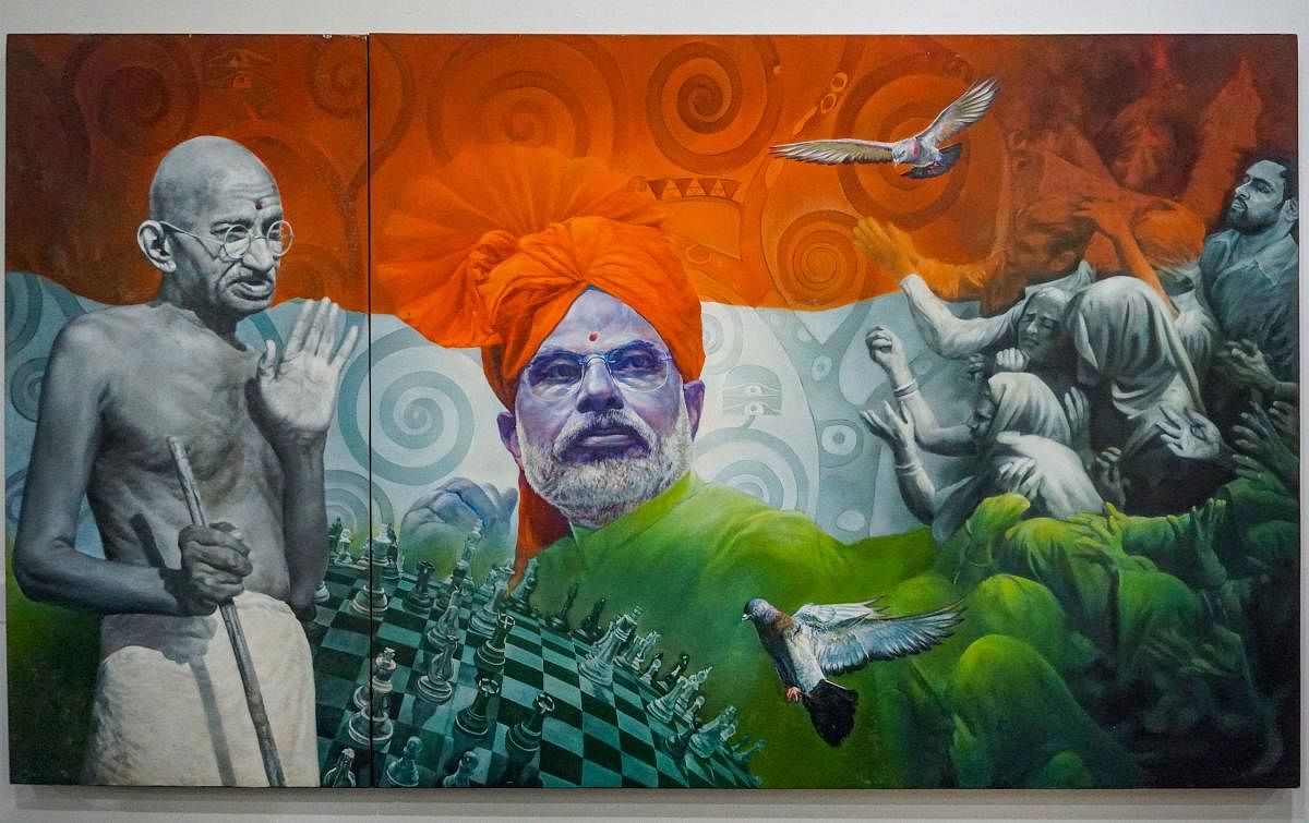 In this undated photo, a view of a painting of Prime Minister Narendra Modi at National Gallery of Modern Art in New Delhi. The exhibition cum e-auctioning of mementos received by PM Modi drew to a close on Friday with the highest bid of Rs 25 lakh for a painting of the PM with Mahatma Gandhi. (PTI Photo)