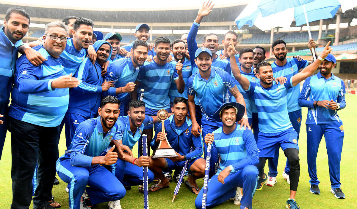 Karnataka celebrate after winning the Vijay Hazare Trophy at the M Chinnaswamy stadium in Bengaluru on Friday. DH PHOTO/ SRIKANTA SHARMA R