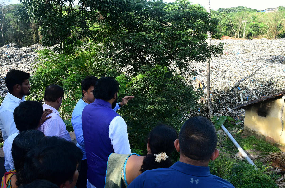 File DH picture of Health Minister Sriramulu visiting garbage slide affected areas