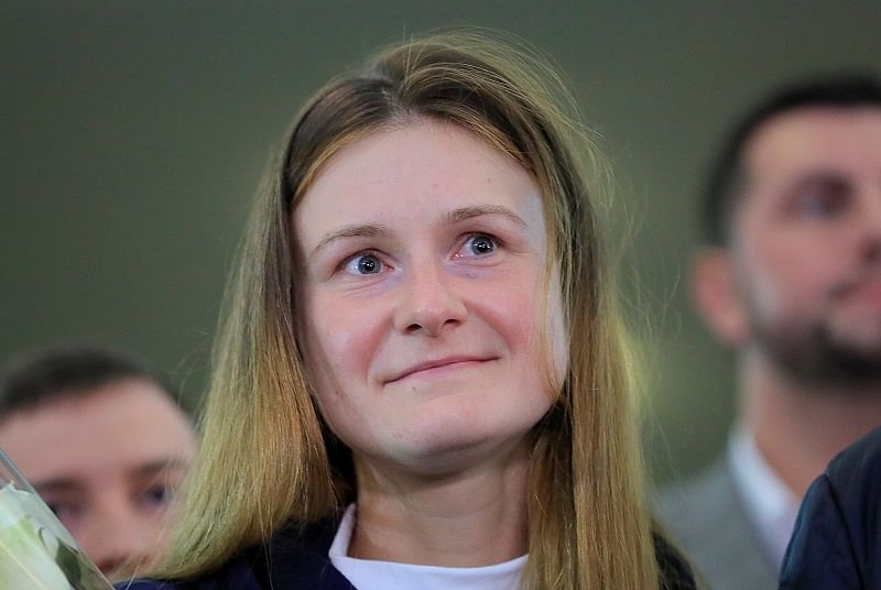 Convicted Russian agent Maria Butina, who was released from a Florida prison and then deported by U.S. immigration officials, meets with journalists upon the arrival at Sheremetyevo International Airport outside Moscow. (Reuters Photo)