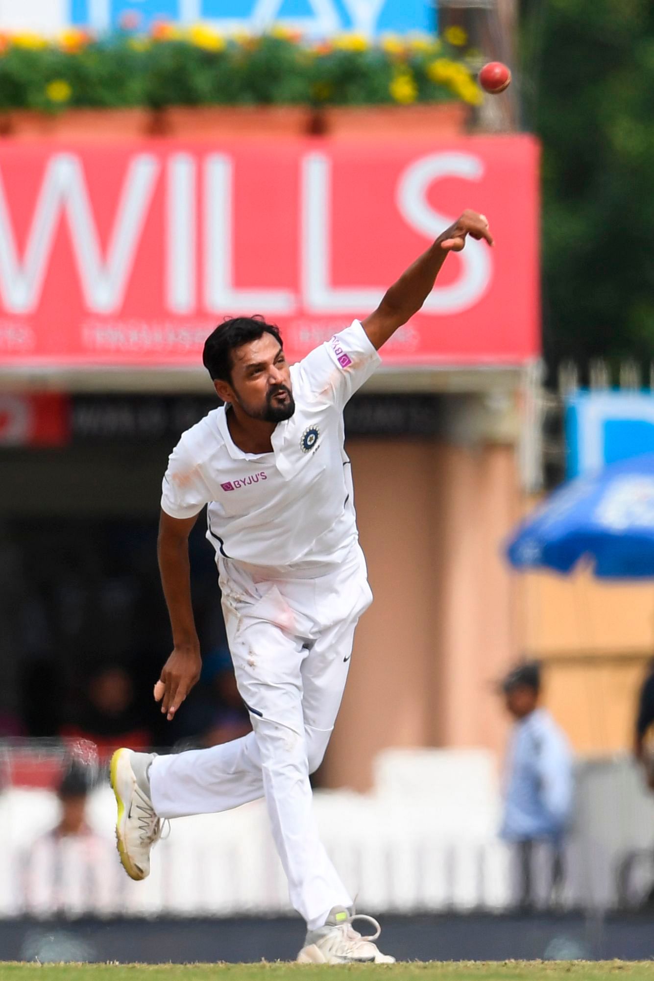 Shahbaz Nadeem delivers a ball during the third day of the third and final Test match between India and South Africa at the Jharkhand State Cricket Association stadium in Ranchi. (AFP Photo)