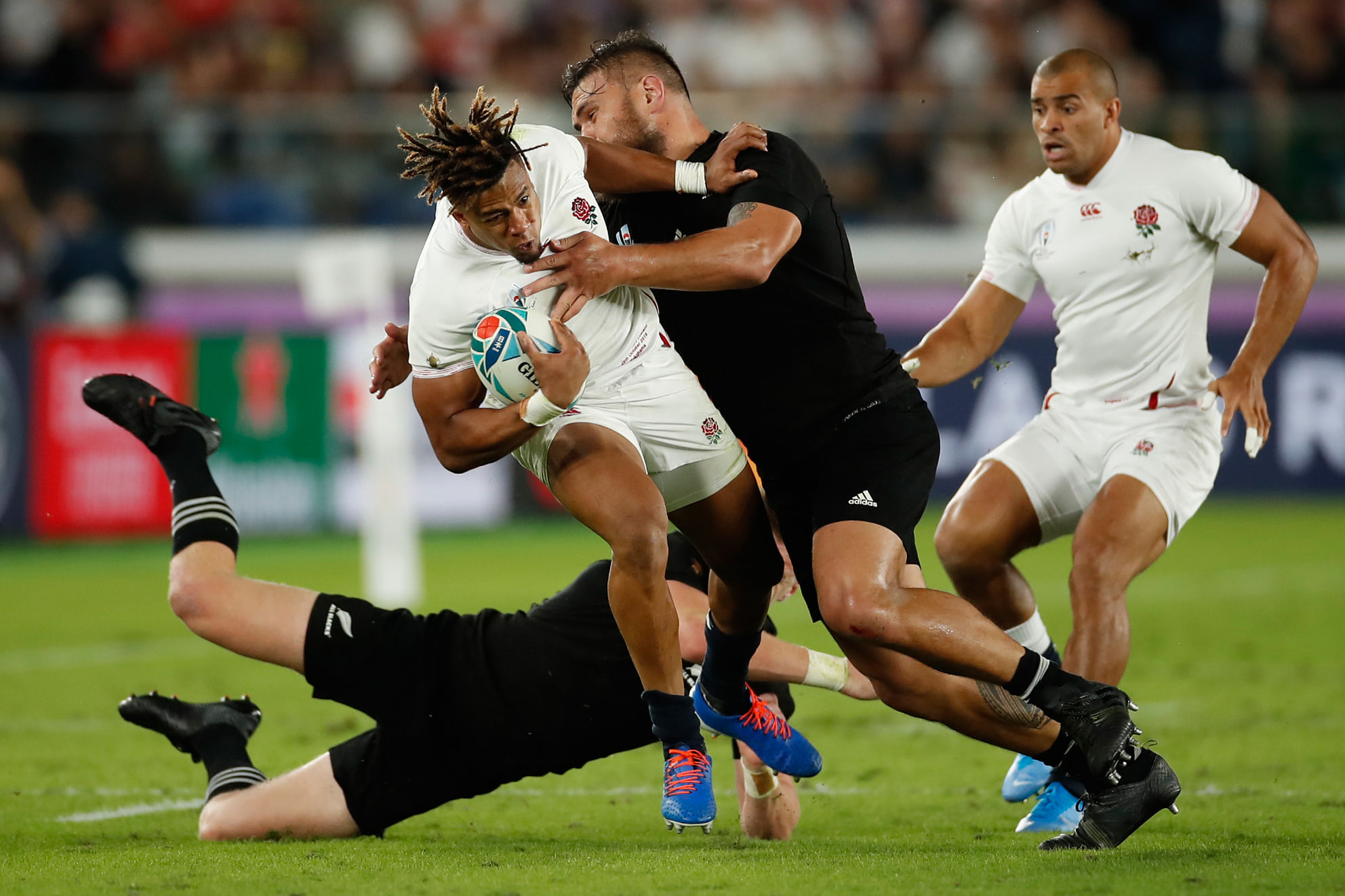 England's wing Anthony Watson (L) is tackled by New Zealand's prop Joe Moody during the Japan 2019 Rugby World Cup semi-final match between England and New Zealand. (AFP Photo)