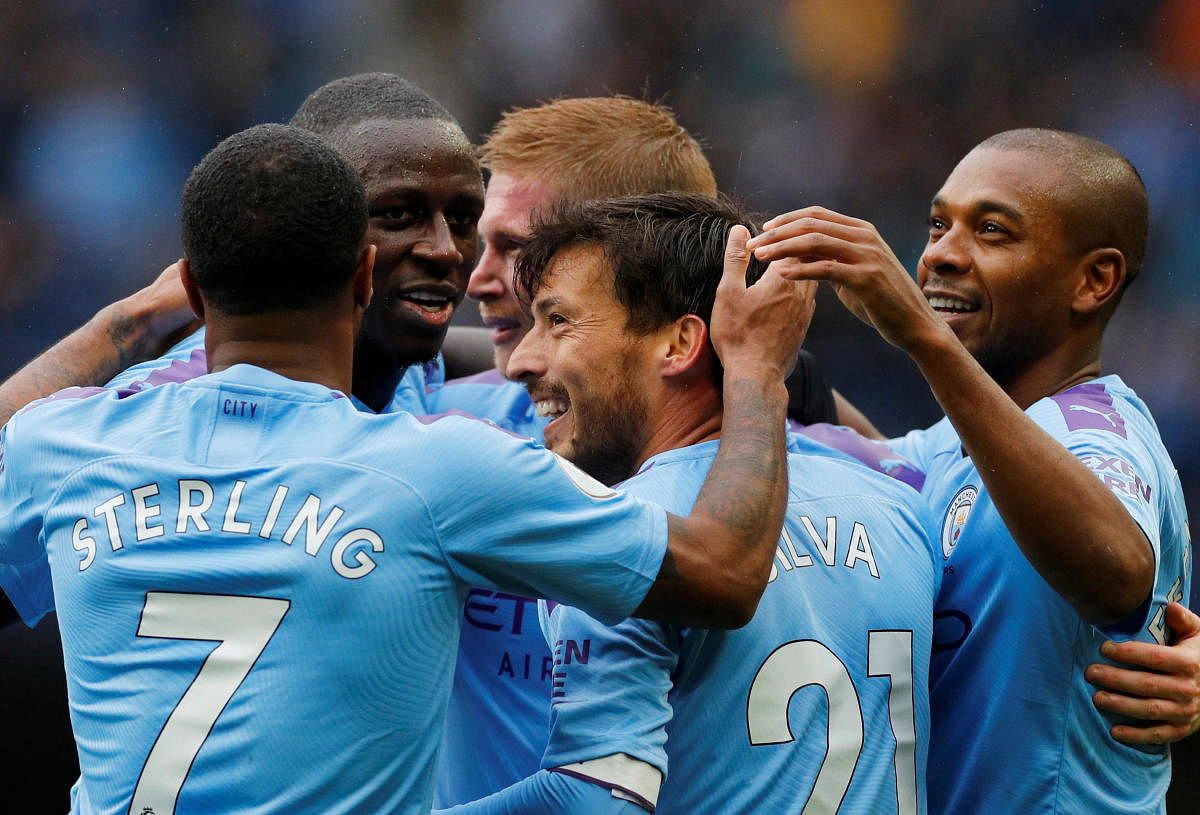 Manchester City's Kevin De Bruyne celebrates scoring their second goal with team mates. REUTERS/Phil Noble 