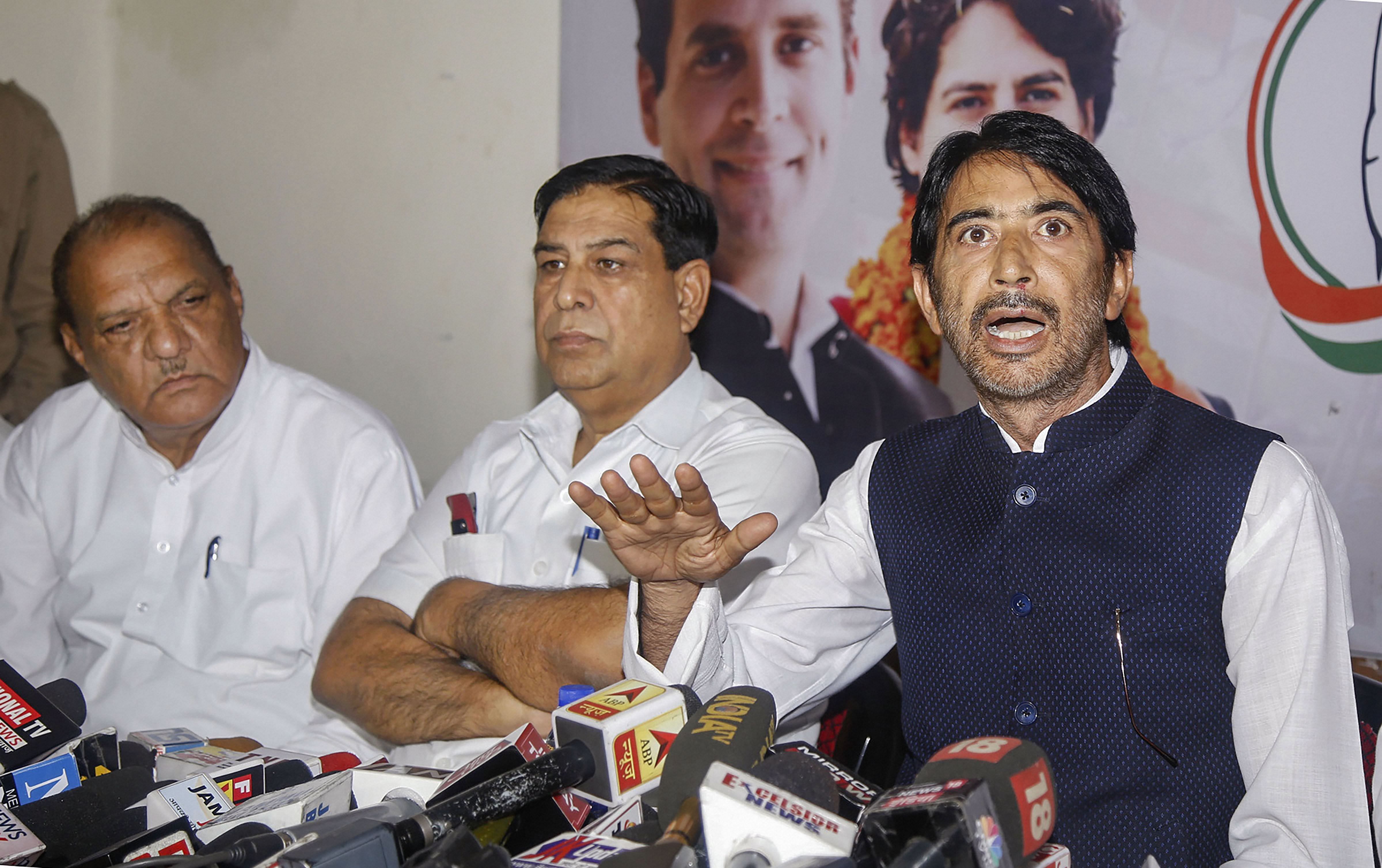 State Congress President G A Mir addresses a press conference, at the party office in Jammu. (PTI Photo)