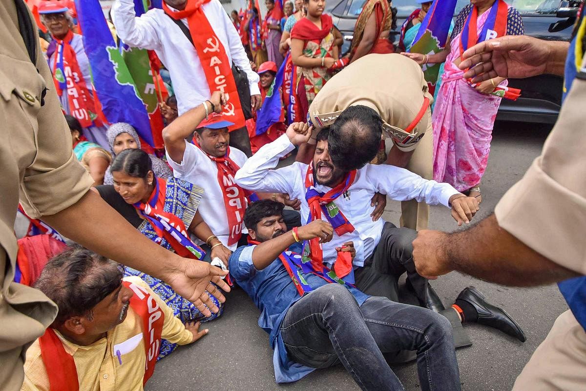 BLF, MCPI (U) activists being detained by police during a protest at Bus Bhavan in solidarity with RTC employees strike in Hyderabad, Friday, Oct. 25, 2019. (PTI Photo)