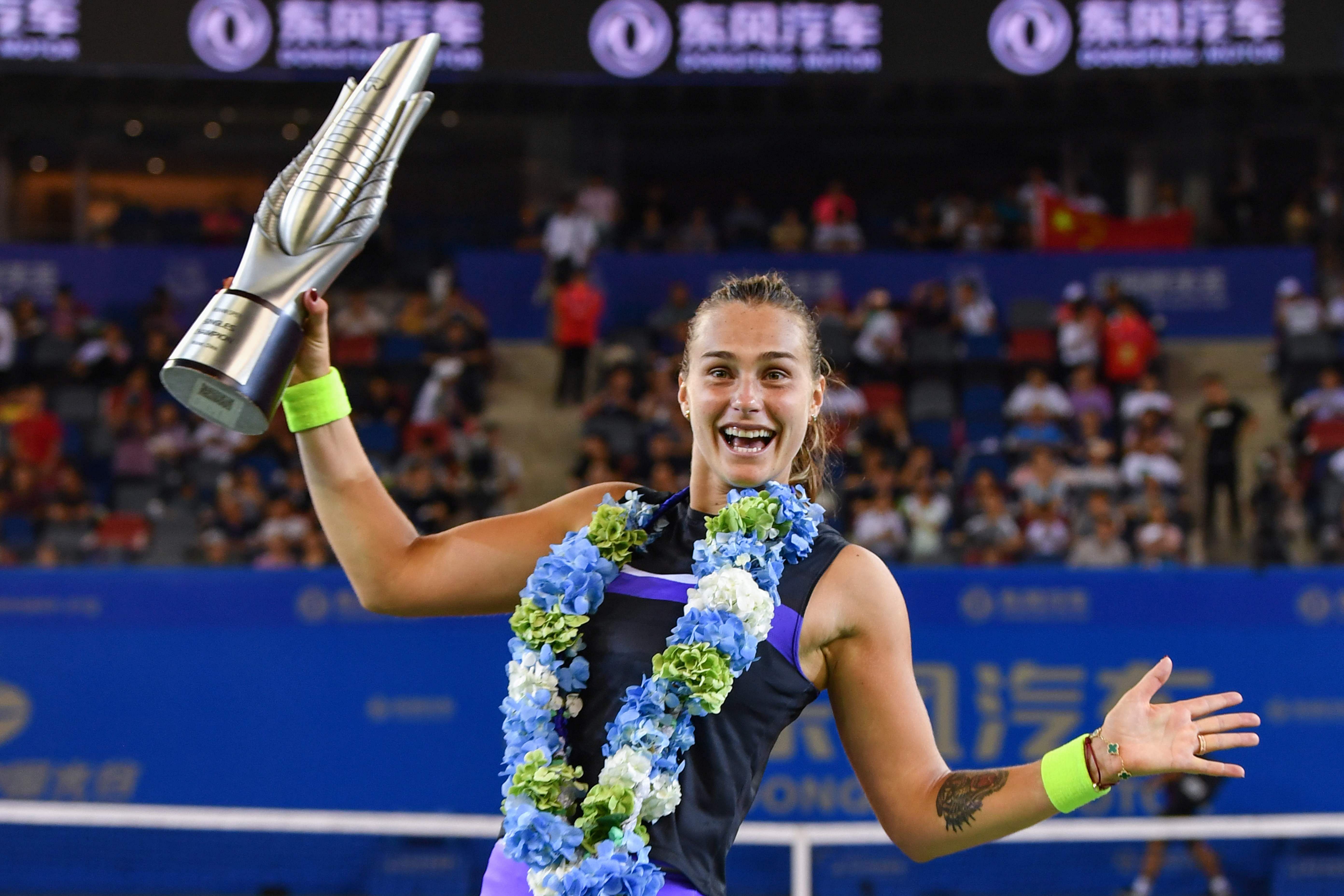 Aryna Sabalenka of Belarus holds the trophy after her victory in the women's singles final match against Alison Riske of the US at the Wuhan Open tennis tournament in Wuhan. (AFP PHoto)