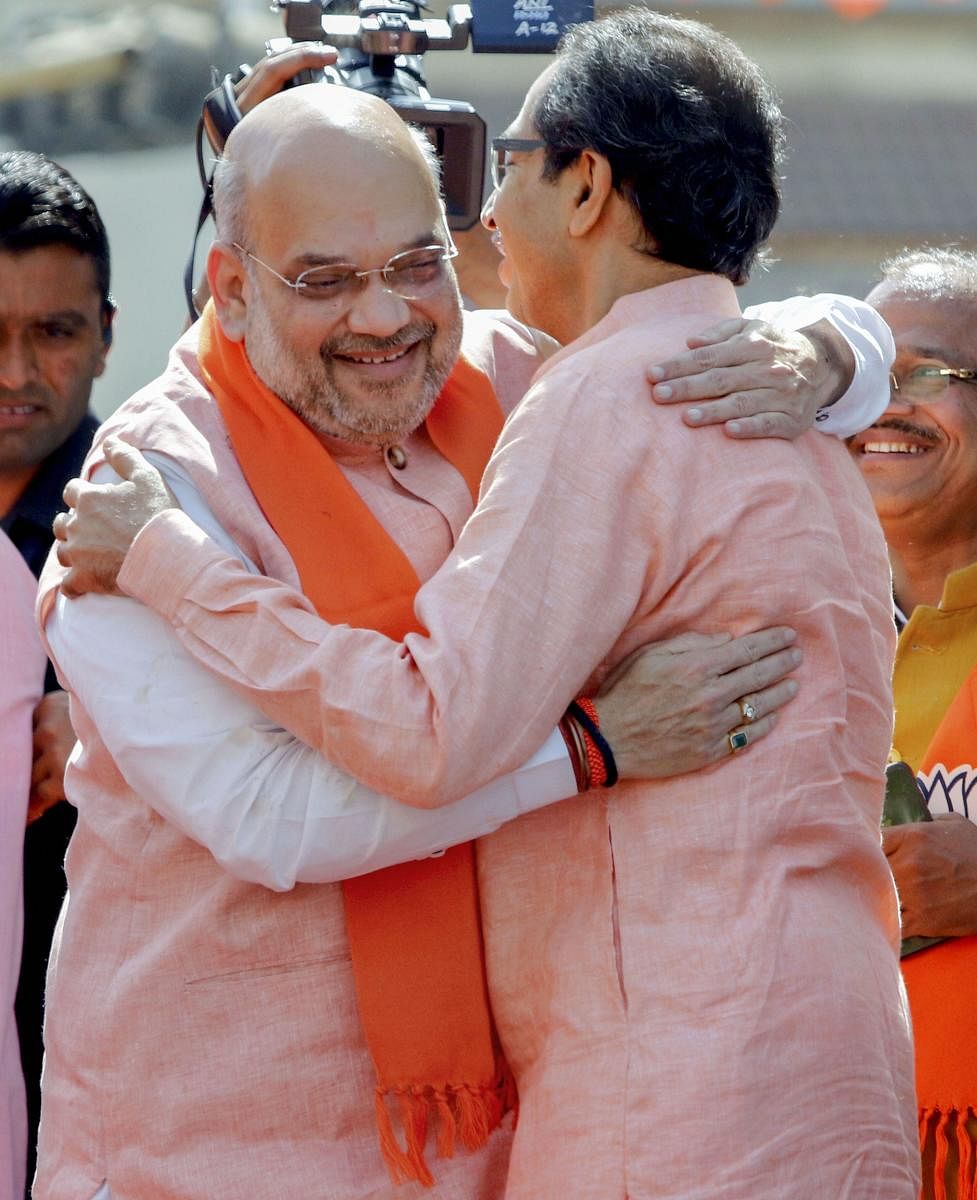 File PTI photo of  BJP National President Amit Shah and Shiv Sena chief Uddhav Thackeray 