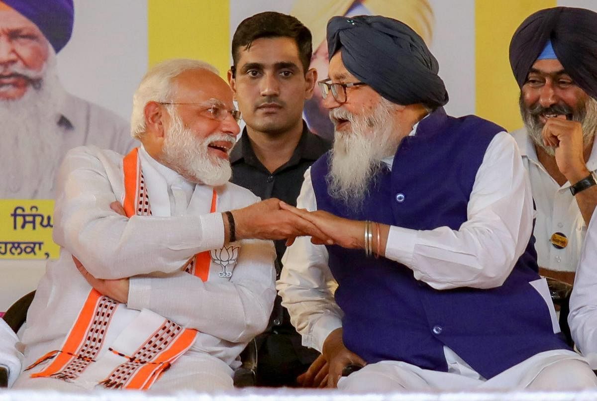 Prime Minister Narendra Modi shares a light moment with Shiromani Akali Dal (SAD) patron and former chief minister of Punjab Parkash Singh Badal. PTI File photo