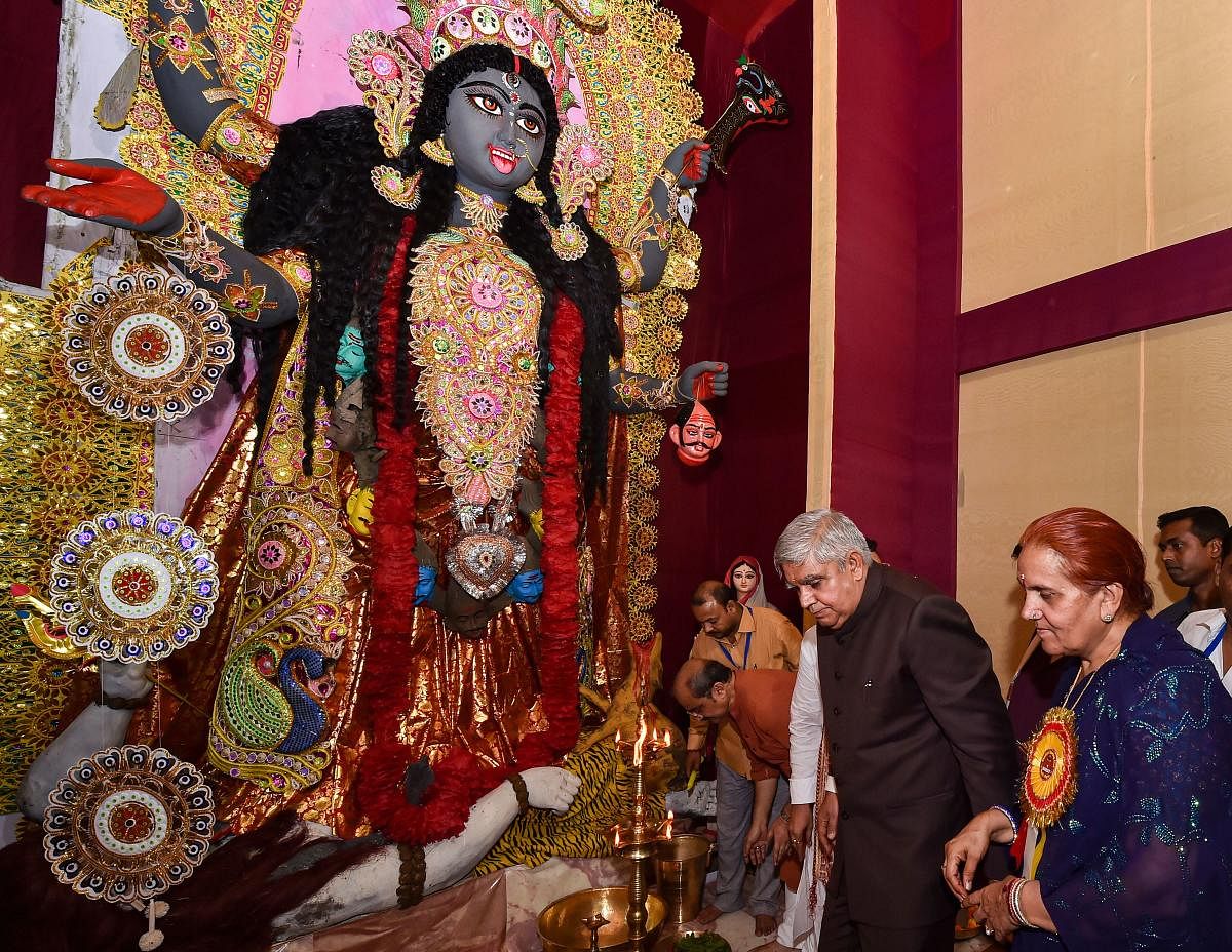 West Bengal Governor Jagdeep Dhankhar and his wife Sudesh Dhankhar during inauguration of a community Kali Puja pandal in Kolkata. (PTI Photo)