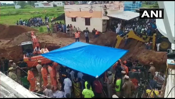 The child, who fell into the 600 ft borewell while playing near his house at Nadukattupatti on Friday evening, was initially struck at a depth of 35 feet but drifted further to over 90 feet with efforts to rescue him commencing last evening. Photo/ANI