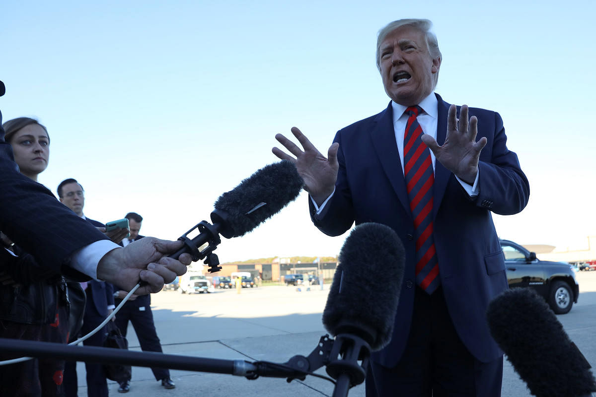 US President Donald Trump talks to reporters prior to boarding Air Force One and departing Washington for travel to Chicago at Joint Base Andrews, Maryland on October 28, 2019. (REUTERS)