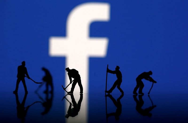  Figurines are seen in front of the Facebook logo in this illustration taken. (Reuters Photo)