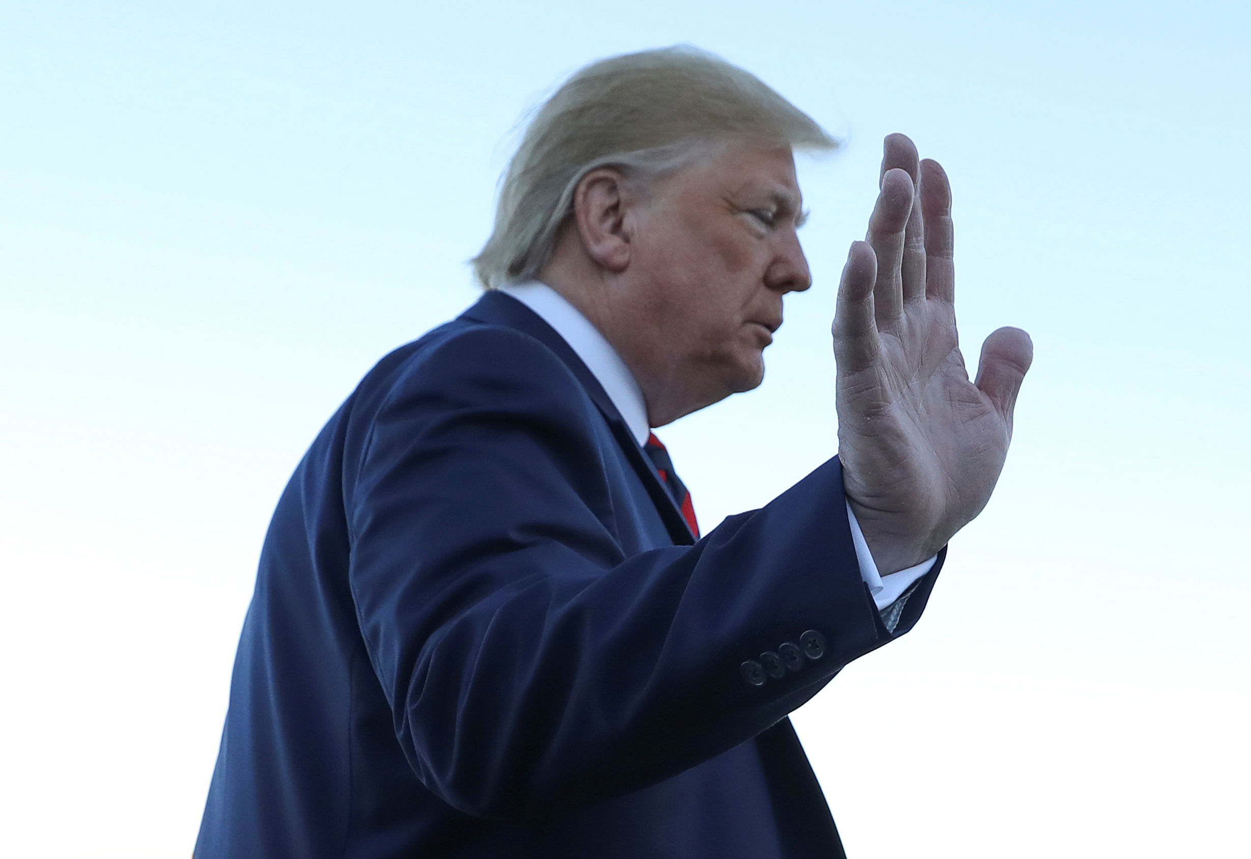 US President Donald Trump waves to reporters prior to departing Washington for travel to Chicago at Joint Base Andrews, Maryland, US. (Reuters Photo)