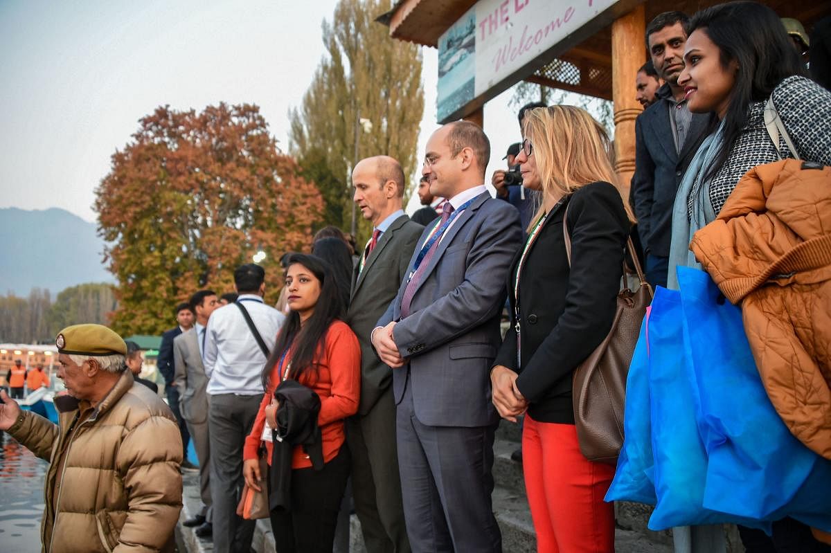 Members of European Union Parliamentary delegation board a shikara ride at Dal Lake in Srinagar, Tuesday, Oct. 29, 2019. Protest broke out in many parts of the city as a European Union MPs visited the valley (PTI Photo/S. Irfan)