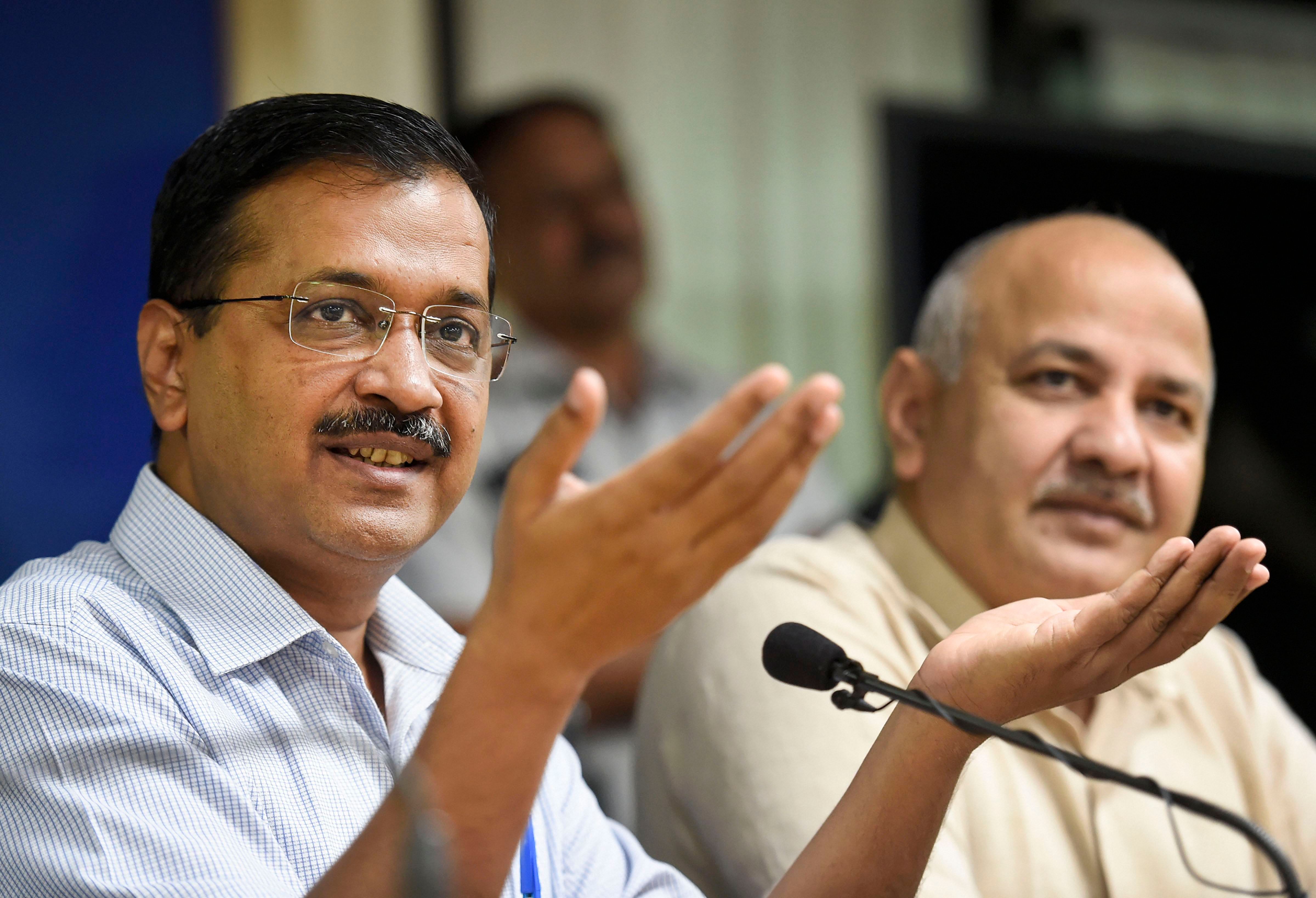 Delhi Chief Minister Arvind Kejriwal with his deputy Manish Sisodia addresses a press conference, in New Delhi. (PTI Photo)
