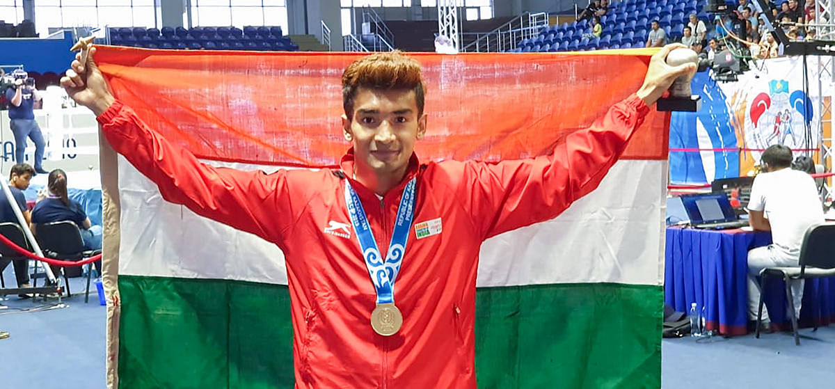 Four-time Asian Championships medallist Shiva Thapa poses for a photo after winning gold. (PTI Photo)