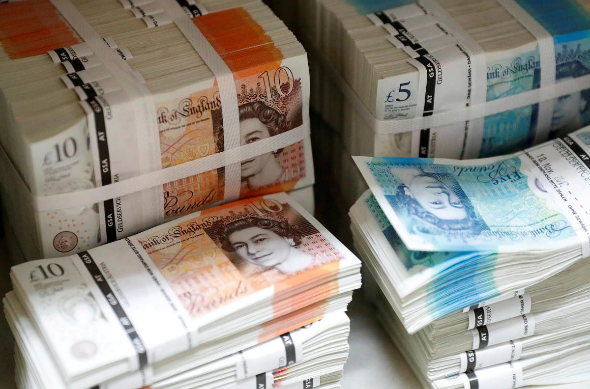 British sterling banknotes stacked in piles. (Reuters Photo)