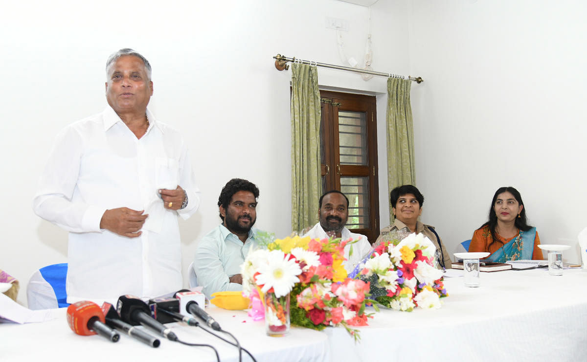 District In-charge Minister V Somanna addresses officials during a meeting at HD Kote in Mysuru district on Sunday. MLA C Anil, ZP Member Venkataswamy, Additional Superintendent of Police P V Sneha and Hunsur Sub-Division Assistant Commissioner B N Veena
