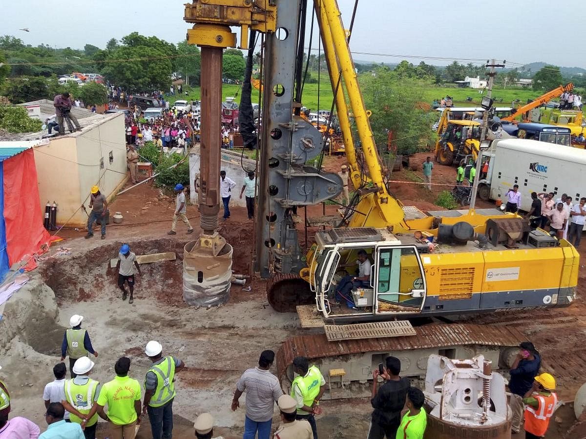 Rescue operation underway to retrieve a boy Sujith who fell into an open borewell on Friday, in Tiruchirapalli on Monday. (PTI Photo)