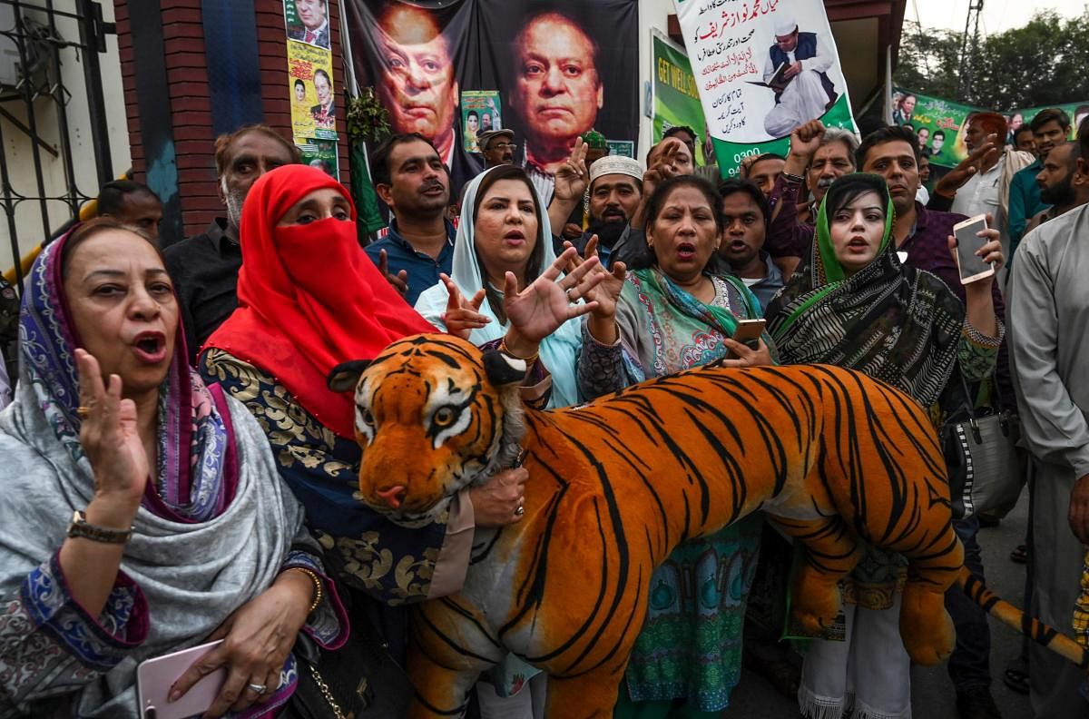 Supporters of Pakistan's former prime minister Nawaz Sharif shout anti-government slogans outside a hospital, where Nawaz was admitted after his condition deteriorated, in Lahore on October 29, 2019. ( AFP)
