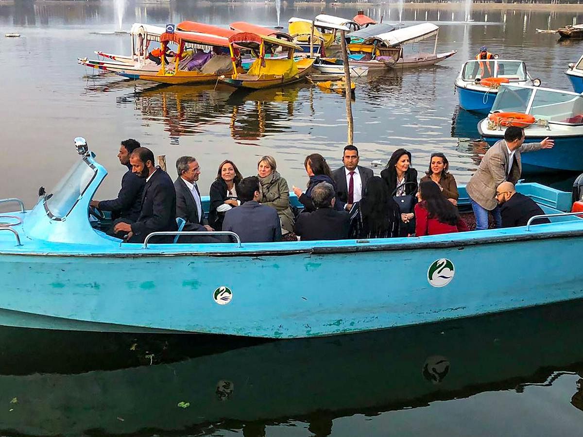 Members of European Union Parliamentary delegation during a shikara ride at Dal Lake in Srinagar, Tuesday, Oct. 29, 2019. Protest broke out in many parts of the city as European Union MPs visited the valley. (PTI Photo)