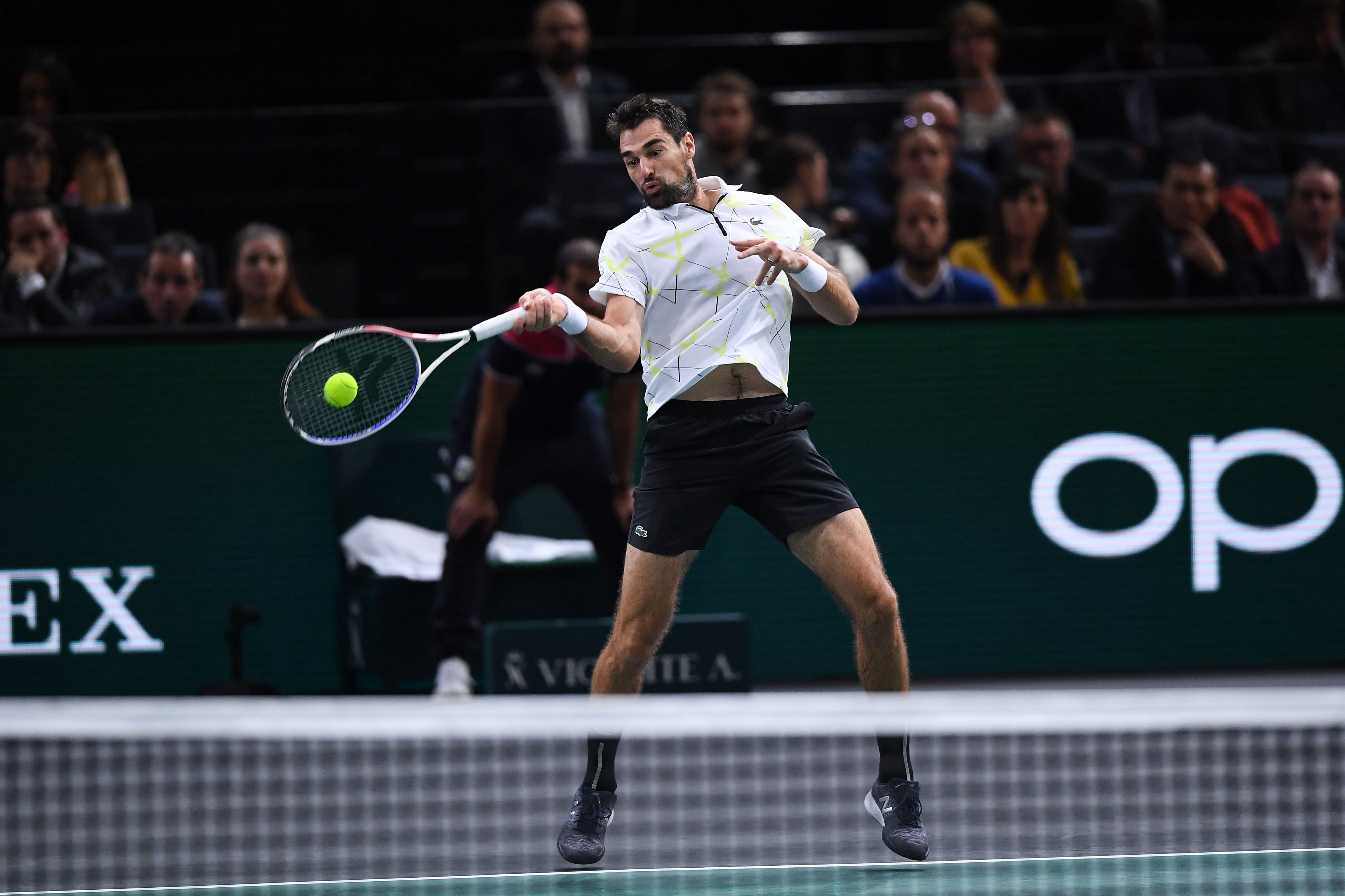 France's Jeremy Chardy returns the ball to Russia's Daniil Medvedev during their men's singles tennis match on day two of the ATP World Tour Masters 1000 - Rolex Paris Masters - indoor tennis tournament at The AccorHotels Arena in Paris. (AFP Photo)
