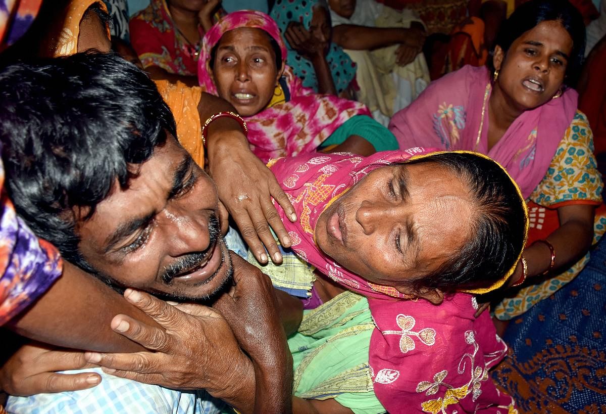 Family members of labourers, who were shot dead by terrorists in Jammu and Kashmir's Kulgam, mourn as bodies of those killed arrive at their village in Murshidabad district of West Bengal, Thursday, Oct. 31, 2019. (PTI Photo)
