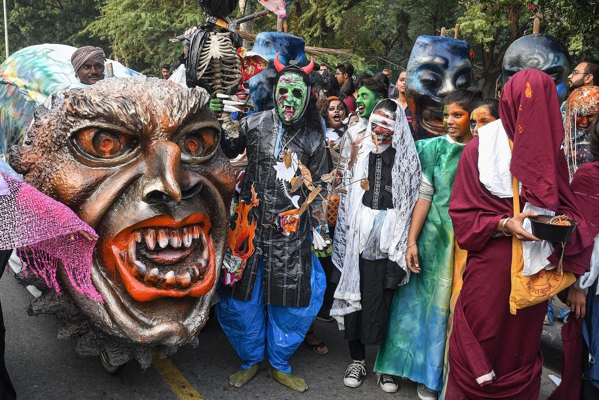 Students dressed in costumes on the theme 'Harrows of Plastic' under the umbrella campaign 'Plastickatimeup' to create an awareness on the ban of single use plastic at Lake Club in Chandigarh, Thursday, Oct. 31, 2019. (PTI Photo)