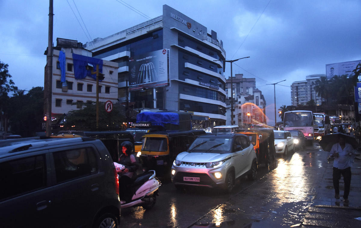 Heavy rains and stagnant water choked the flow of traffic on most arterial roads as in Hampankatta in Mangaluru on Thursday.